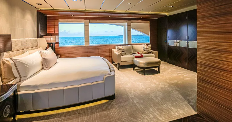 W Yacht Photos Pics Luxurious Feadship yacht bedroom interior with ocean view, featuring elegant furnishings and modern design.