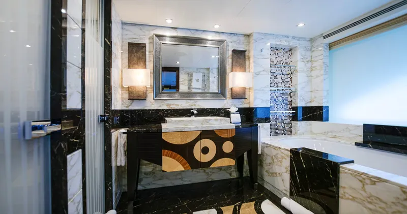 W Yacht Photos Pics Luxurious Feadship yacht bathroom, 2013 model, featuring elegant marble and modern design elements.