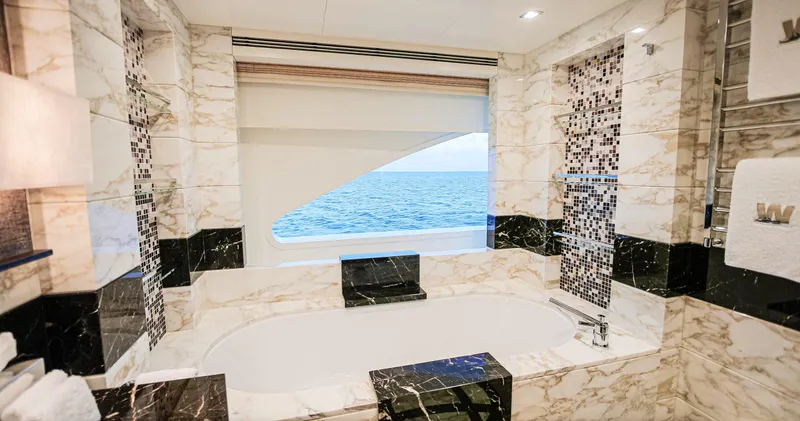 W Yacht Photos Pics Luxurious marble bathroom on 2013 Feadship yacht with ocean view.