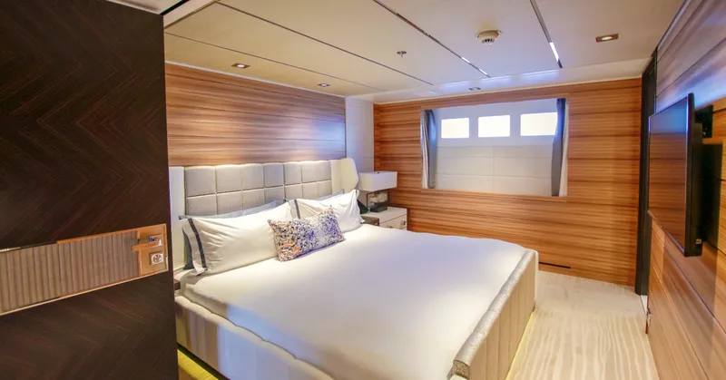 W Yacht Photos Pics Luxurious bedroom interior on 2013 Feadship yacht, featuring modern design and elegant wood paneling.