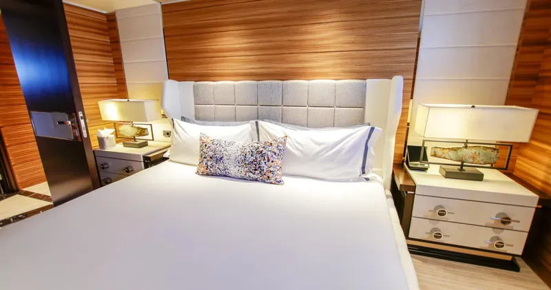W Yacht Photos Pics Luxurious bedroom interior on 2013 Feadship yacht, featuring elegant bedding and modern lighting.