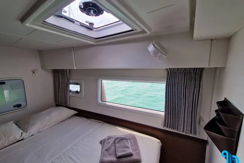  Yacht Photos Pics Interior cabin of 2020 Lagoon 42 catamaran with ocean view and skylight.