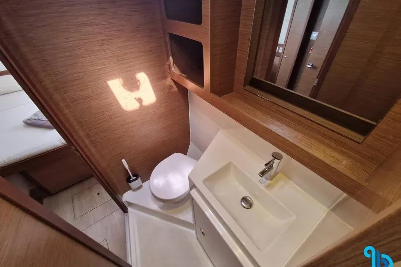  Yacht Photos Pics Modern bathroom interior of 2020 Lagoon 42 yacht, featuring sink and toilet.