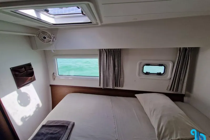 Yacht Photos Pics Cozy cabin interior of 2020 Lagoon 42 catamaran with ocean view windows.