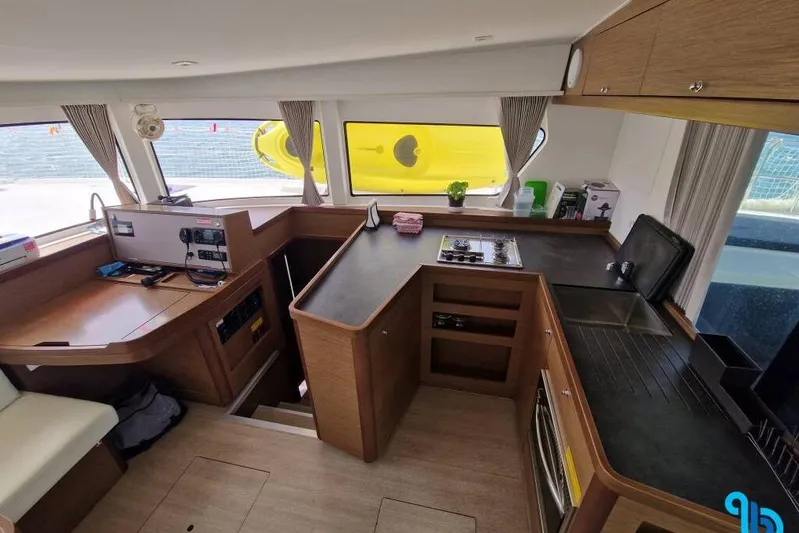  Yacht Photos Pics Interior of 2020 Lagoon 42 catamaran with modern kitchen and navigation area.