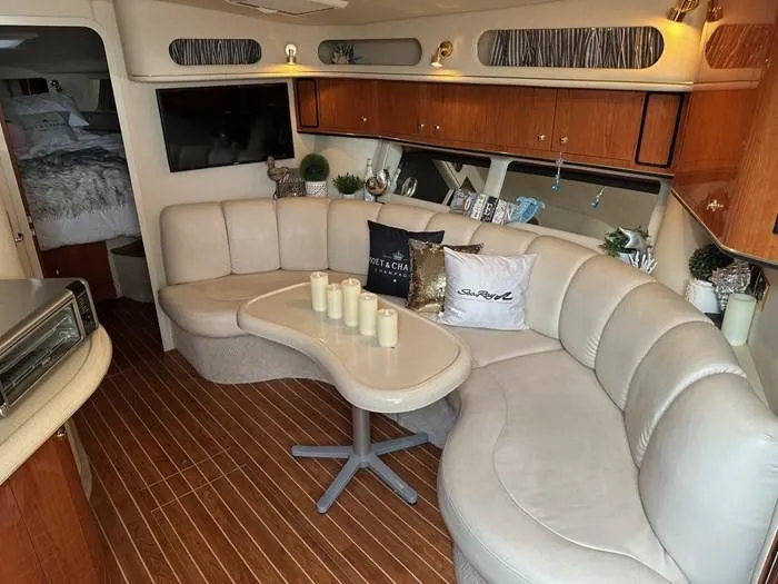 L'eternel Yacht Photos Pics Luxurious 1998 Sea Ray 400 Sundancer interior with plush seating and elegant decor.