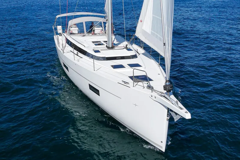 Tuanis Yacht Photos Pics 2023 Bavaria C50 yacht sailing on open blue waters.