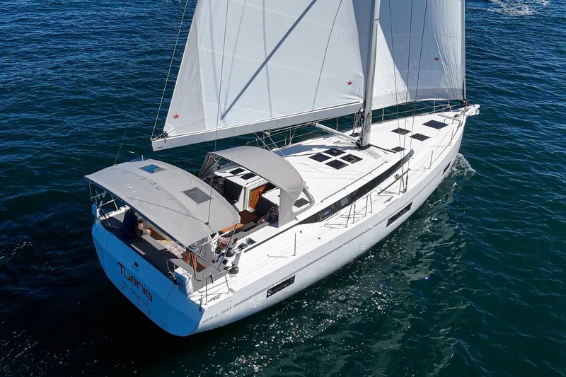 Tuanis Yacht Photos Pics 2023 Bavaria C50 yacht sailing on open water, showcasing sleek design and spacious deck.