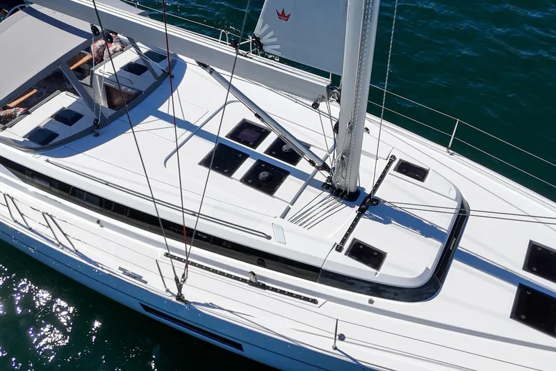 Tuanis Yacht Photos Pics 2023 Bavaria C50 yacht, aerial view, sleek design, sailing on blue water.