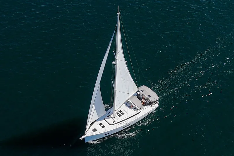Tuanis Yacht Photos Pics 2023 Bavaria C50 sailing yacht gliding on open sea waters.