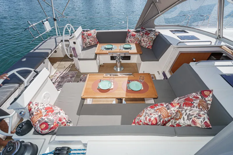 Tuanis Yacht Photos Pics Luxurious 2023 Bavaria C50 yacht deck with elegant seating and dining setup.