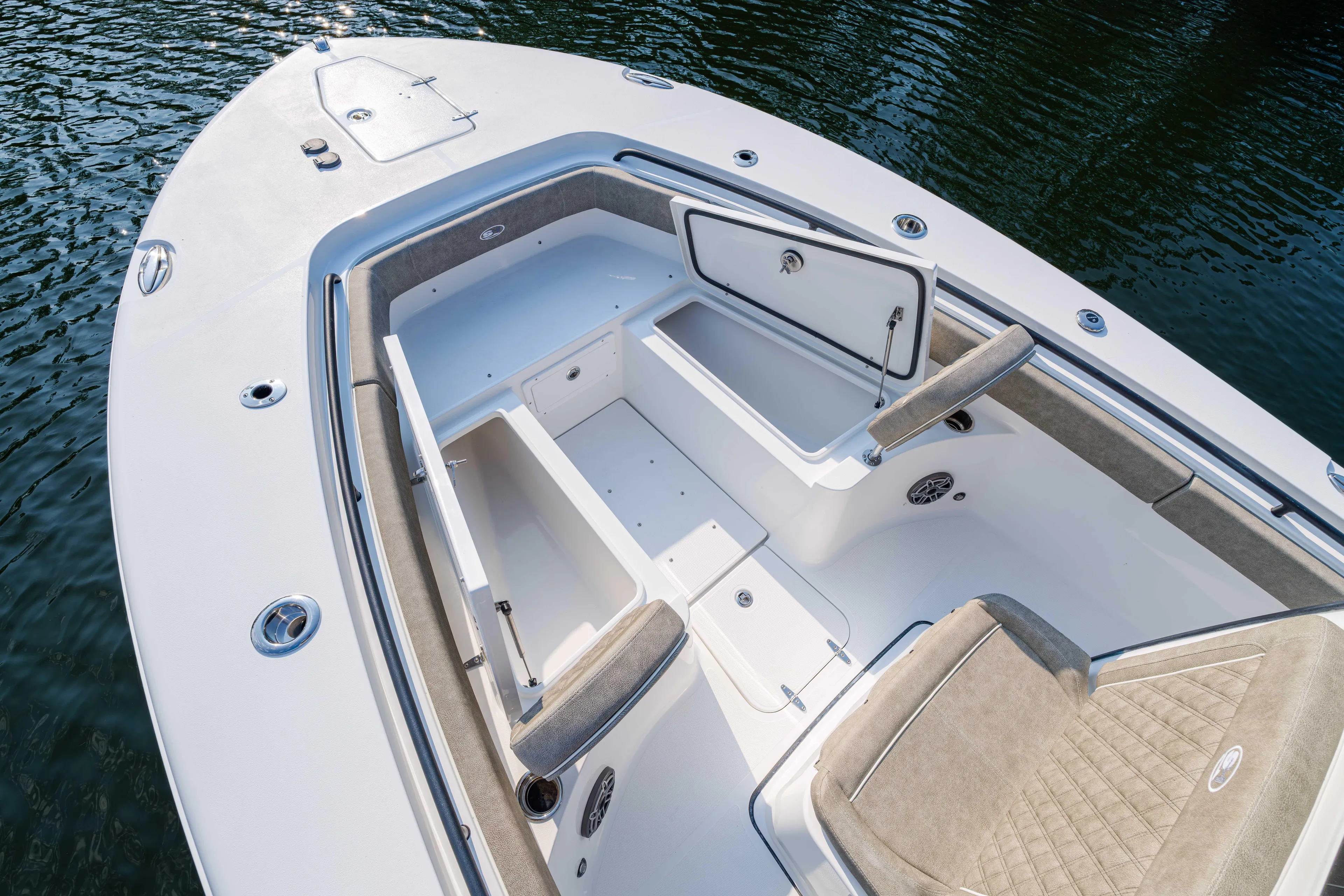  Yacht Photos Pics 2026 Sea Hunt Gamefish 25 boat interior with open storage compartments and cushioned seating.