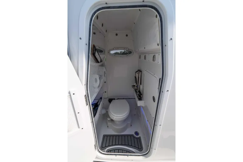  Yacht Photos Pics Interior of 2026 Sea Hunt Gamefish 25 boat's compact bathroom with toilet.