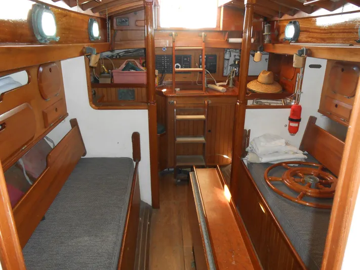 Merrywing Yacht Photos Pics Interior of a 1962 Custom Merrywing boat with wooden furnishings and nautical decor.