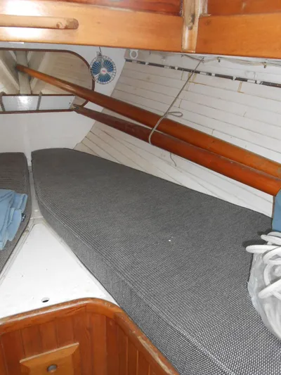 Merrywing Yacht Photos Pics Interior of a 1962 Custom Merrywing boat with wooden accents and cushioned seating.