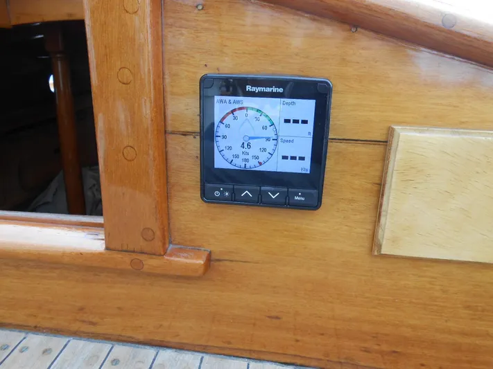 Merrywing Yacht Photos Pics Raymarine instrument on 1962 Custom Merrywing boat, mounted on polished wooden panel.