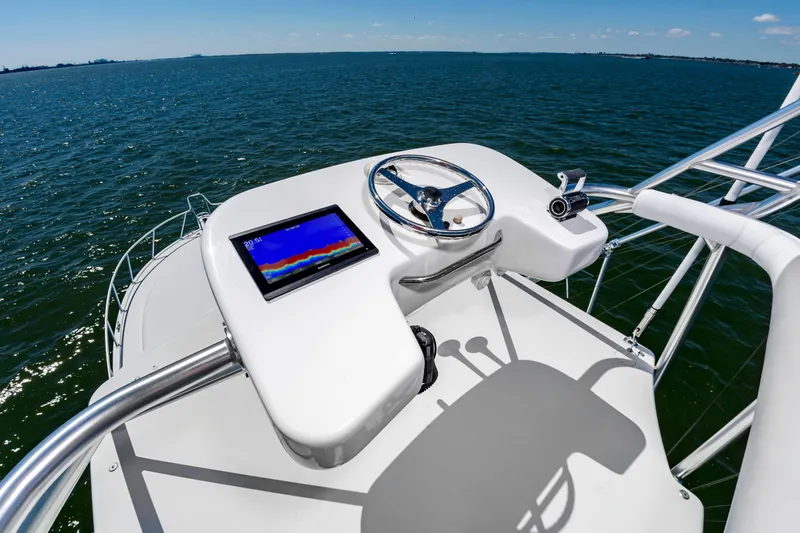 Salt Shaker Yacht Photos Pics Helm of 2008 Cabo 40 Express on open sea.