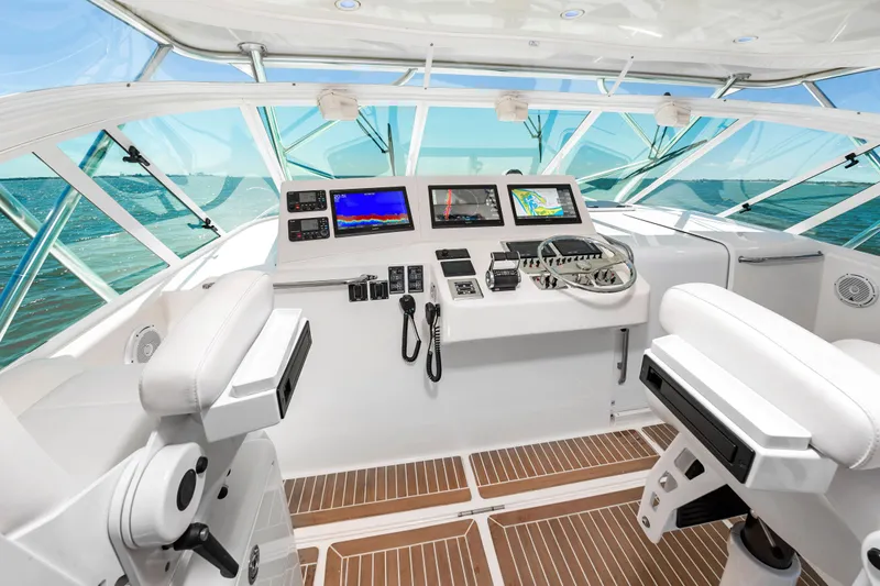 Salt Shaker Yacht Photos Pics Interior view of 2008 Cabo 40 Express helm at sea.