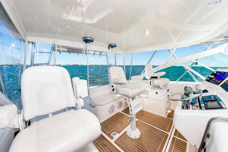 Salt Shaker Yacht Photos Pics Interior of 2008 Cabo 40 Express yacht with luxurious seating and controls.