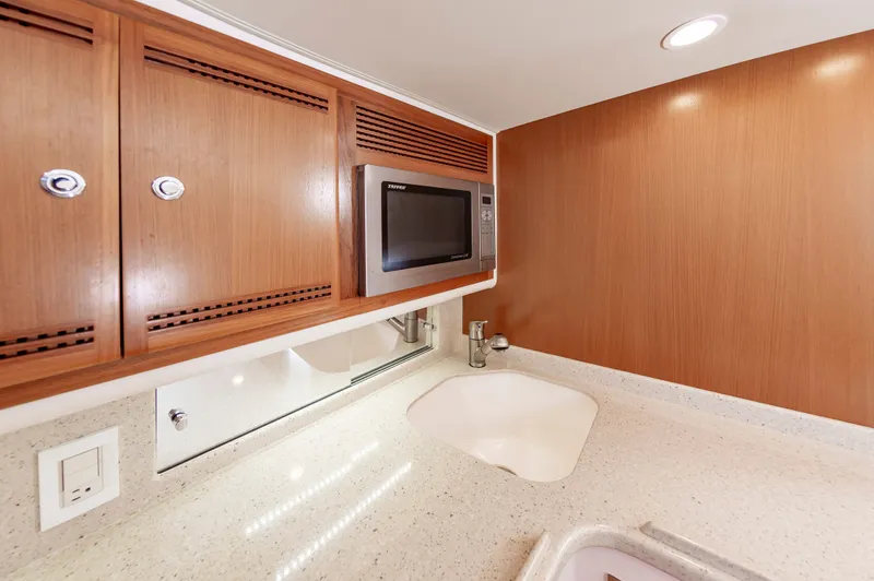 Salt Shaker Yacht Photos Pics Galley kitchen in a 2008 Cabo 40 Express yacht.