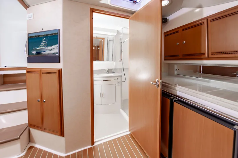 Salt Shaker Yacht Photos Pics Interior of 2008 Cabo 40 Express yacht featuring kitchen and bathroom.