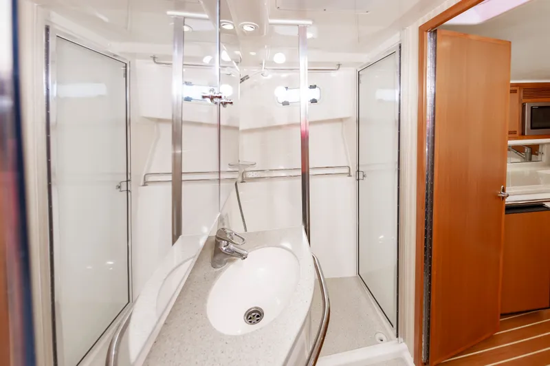 Salt Shaker Yacht Photos Pics Interior of 2008 Cabo 40 Express with bathroom and shower.