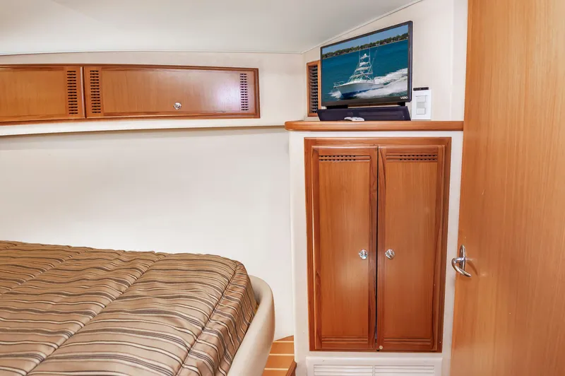 Salt Shaker Yacht Photos Pics Interior of 2008 Cabo 40 Express with bed and TV.