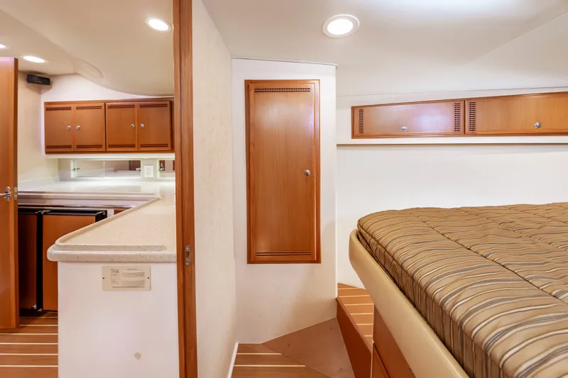 Salt Shaker Yacht Photos Pics Interior of 2008 Cabo 40 Express yacht with kitchen and sleeping area.