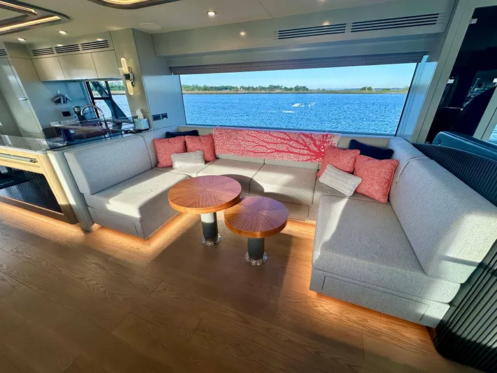  Yacht Photos Pics Luxurious 2024 Sirena 68 yacht interior with elegant seating and scenic ocean view.