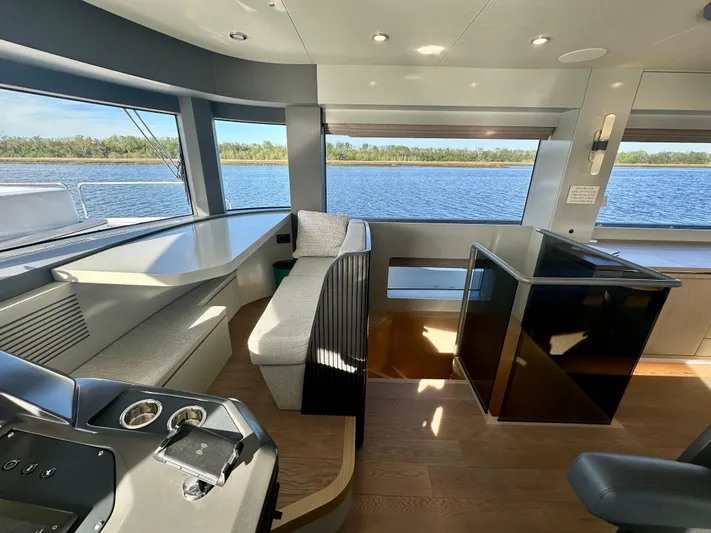  Yacht Photos Pics Luxurious interior of 2024 Sirena 68 yacht with panoramic windows and modern seating.