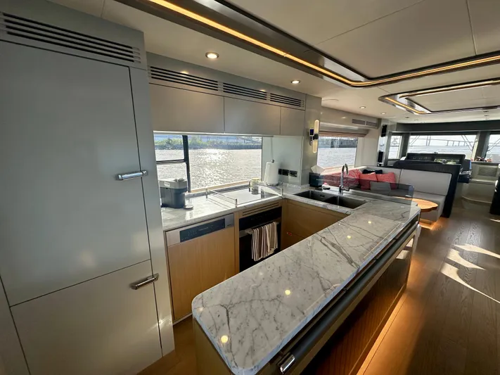  Yacht Photos Pics Luxurious interior of 2024 Sirena 68 yacht with modern kitchen and elegant marble countertops.
