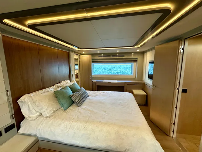  Yacht Photos Pics Luxurious bedroom interior of 2024 Sirena 68 yacht with modern design and ocean view.
