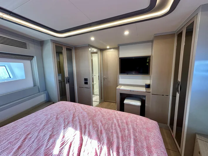  Yacht Photos Pics Luxurious bedroom interior of 2024 Sirena 68 yacht with modern design and amenities.