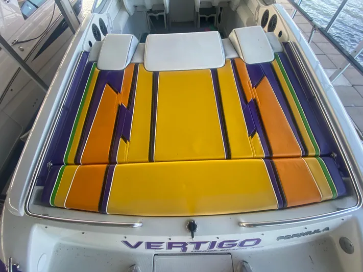  Yacht Photos Pics 2006 Formula 353 FASTech boat with vibrant yellow, orange, and purple seating.