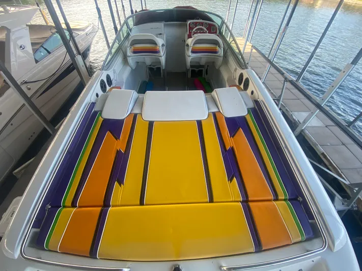  Yacht Photos Pics 2006 Formula 353 FASTech boat with vibrant, colorful seating and sleek design at a dock.