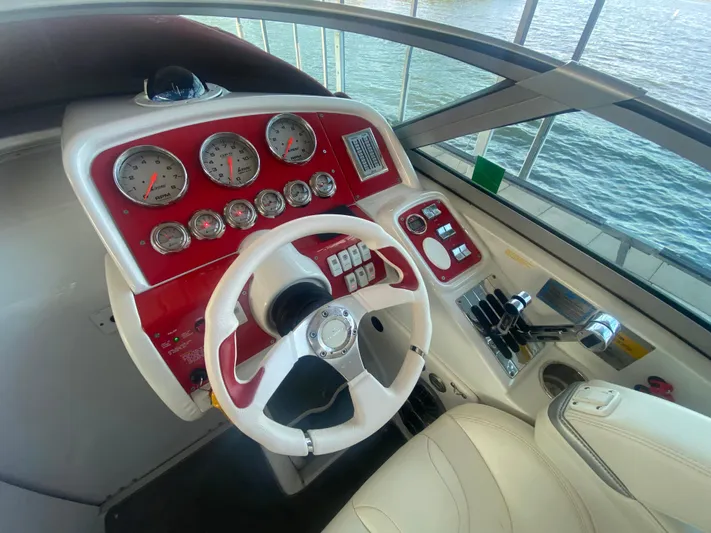  Yacht Photos Pics 2006 Formula 353 FASTech boat dashboard with red accents and multiple gauges.