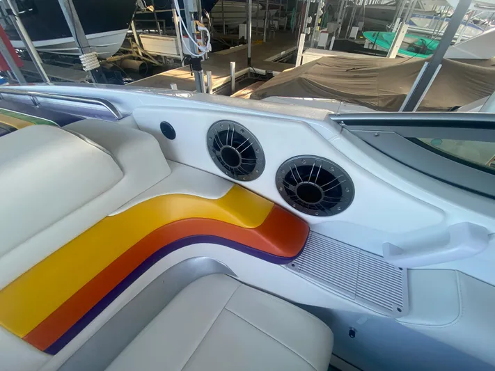  Yacht Photos Pics 2006 Formula 353 FASTech boat interior with colorful seating and dual speakers.