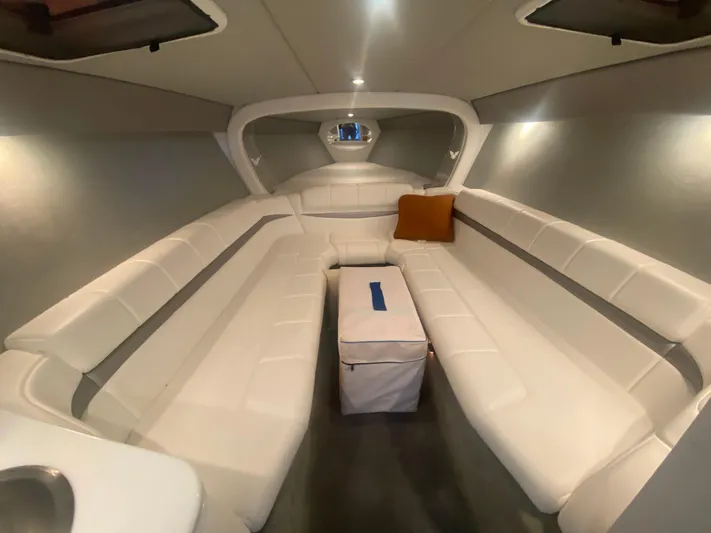  Yacht Photos Pics 2006 Formula 353 FASTech cabin interior with white seating and a central cushion.