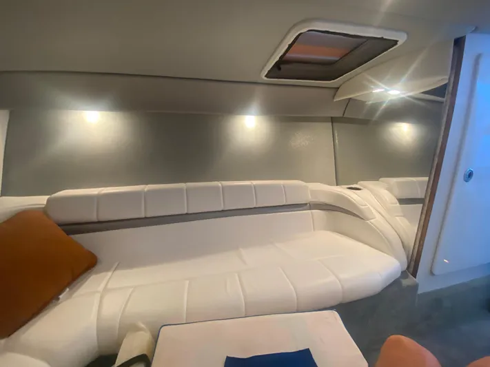  Yacht Photos Pics Interior of 2006 Formula 353 FASTech boat with white seating and ambient lighting.