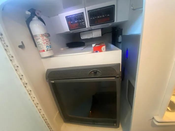  Yacht Photos Pics 2006 Formula 353 FASTech cabin interior with fire extinguisher and control panel.