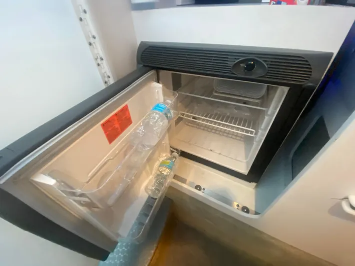  Yacht Photos Pics Open mini fridge in 2006 Formula 353 FASTech boat with water bottles inside.