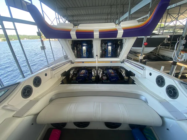  Yacht Photos Pics 2006 Formula 353 FASTech boat engine compartment with open hatch, docked by the water.