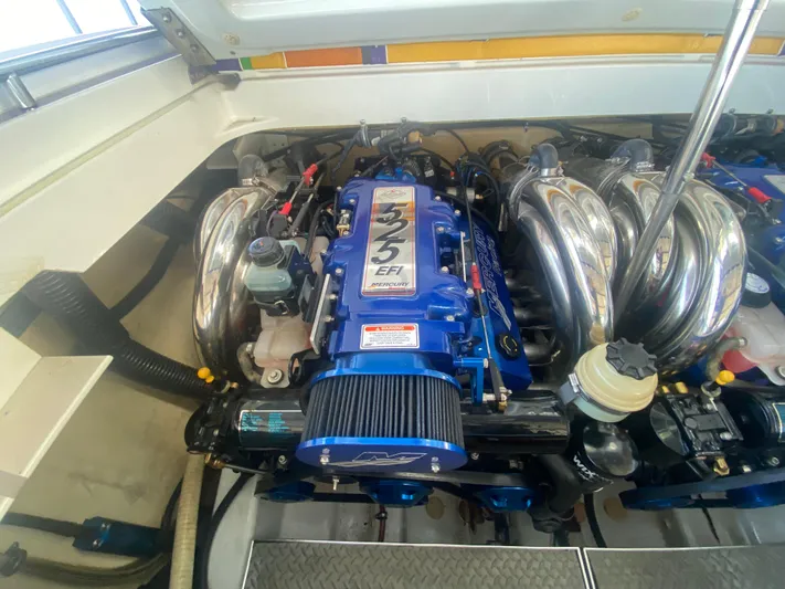  Yacht Photos Pics 2006 Formula 353 FASTech engine compartment with blue EFI engine and chrome components.