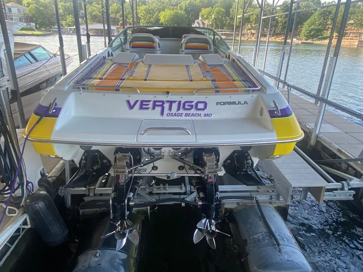  Yacht Photos Pics 2006 Formula 353 FASTech boat docked, featuring vibrant colors and dual propellers.
