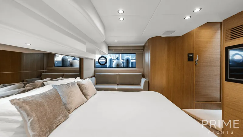  Yacht Photos Pics Luxurious cabin interior of 2019 Princess F49 yacht with modern design and cozy seating.