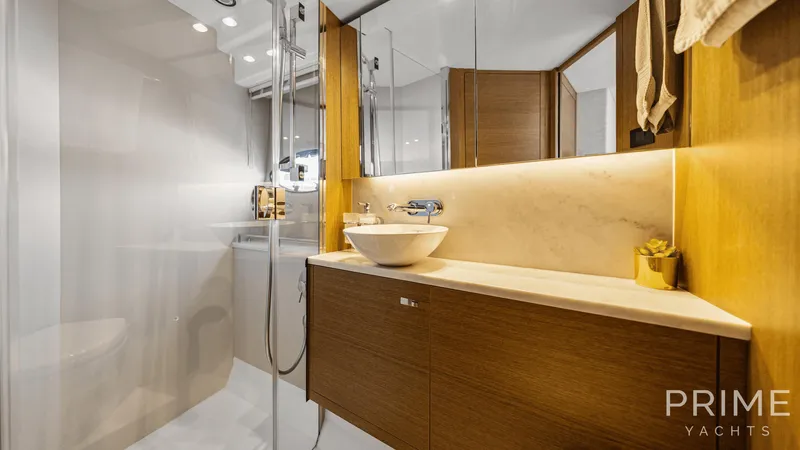  Yacht Photos Pics Luxurious bathroom in 2019 Princess F49 yacht with modern fixtures and elegant design.