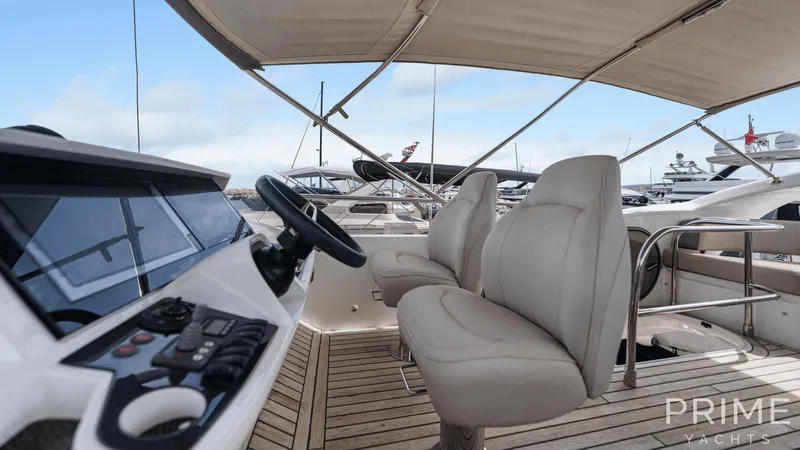  Yacht Photos Pics Luxurious 2019 Princess F49 yacht interior with helm and plush seating.