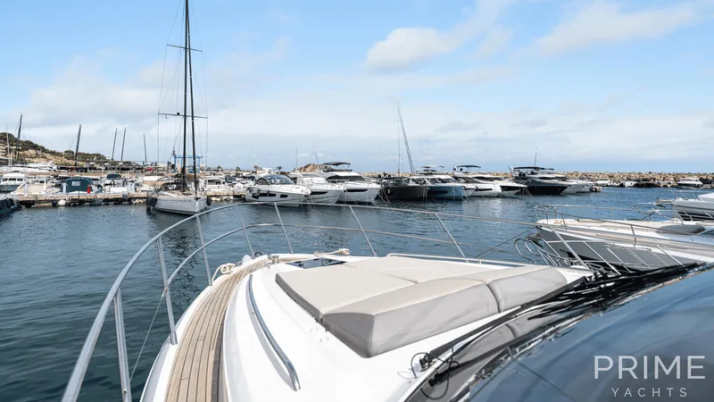 Yacht Photos Pics Luxurious 2019 Princess F49 yacht docked in a scenic marina.
