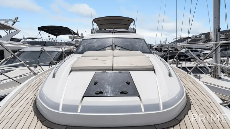  Yacht Photos Pics Luxurious 2019 Princess F49 yacht docked, featuring sleek design and spacious sunbathing area.