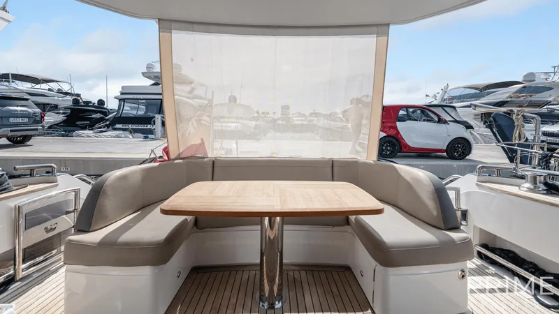  Yacht Photos Pics Luxurious 2019 Princess F49 yacht interior with elegant seating and wooden table.